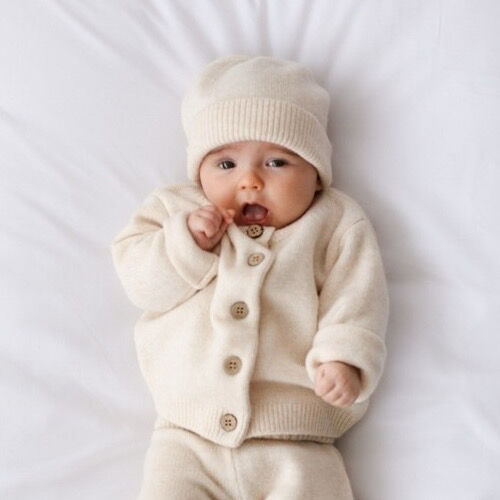 Wrap your little ones in the softness and warmth of our exquisite Baby and Child Cardigan. Crafted from the finest 100% wool with a soft cashmere feel, In a classic soft ivory colour with a hint of blush this cardigan ensures a touch of luxury that's gentle on delicate skin. Available from www.thecollectivenz.com