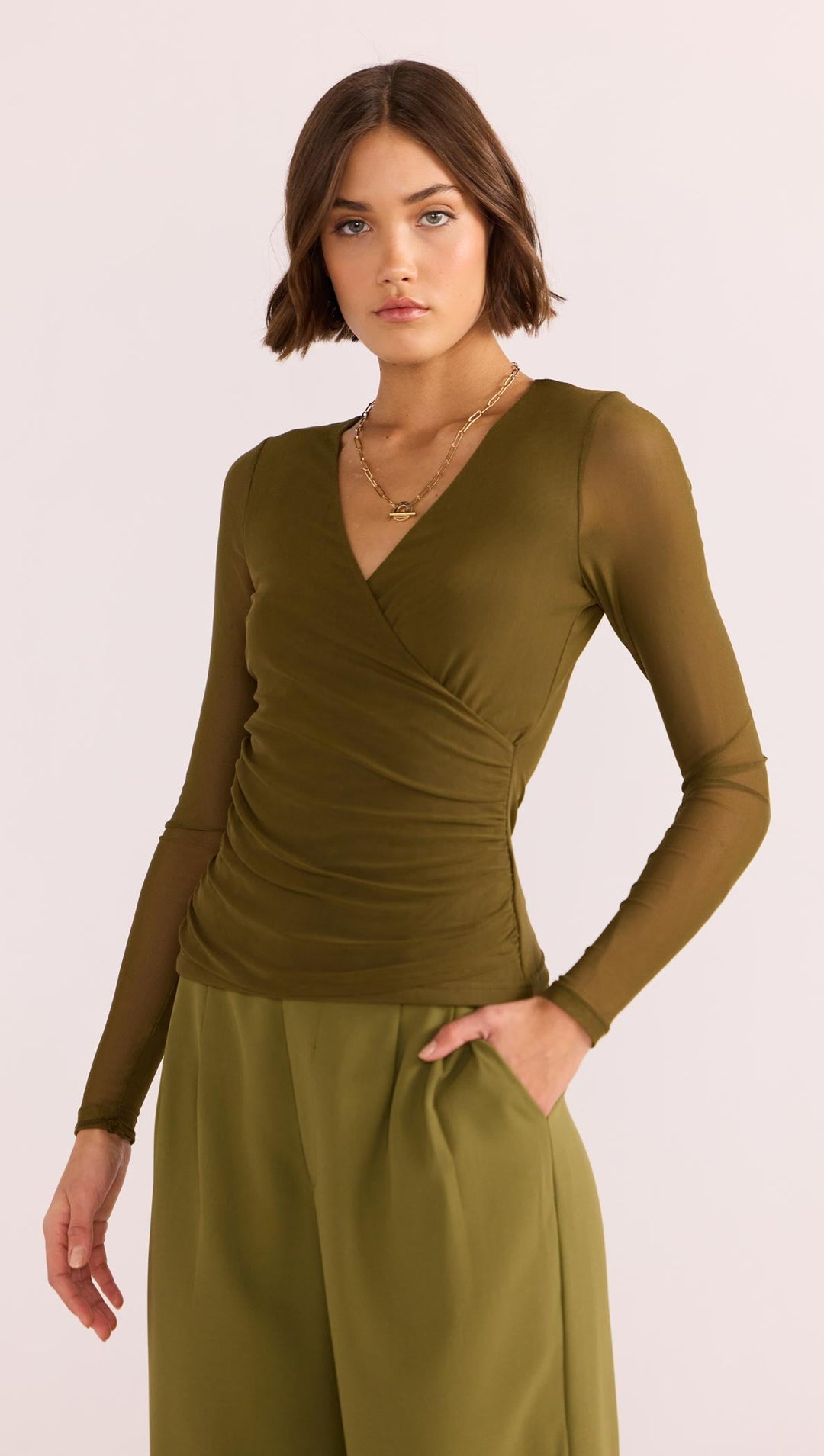 The Elodie Mesh Wrap Top by MINKPINK will easily become part of your capsule wardrobe. Available from www.thecollectivenz.com