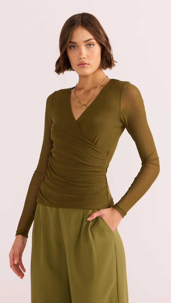 The Elodie Mesh Wrap Top by MINKPINK will easily become part of your capsule wardrobe. Available from www.thecollectivenz.com