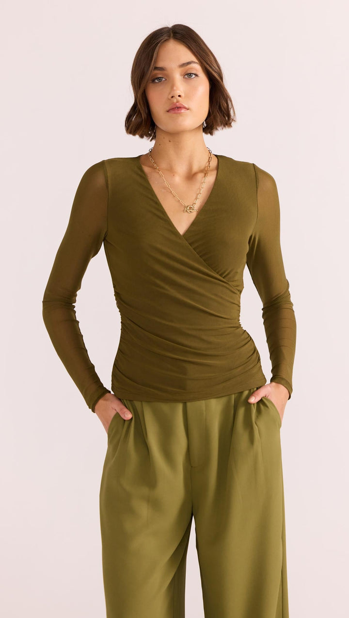 The Elodie Mesh Wrap Top by MINKPINK will easily become part of your capsule wardrobe. Available from www.thecollectivenz.com