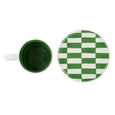 Green and white checkered mug and matching lid on a white background