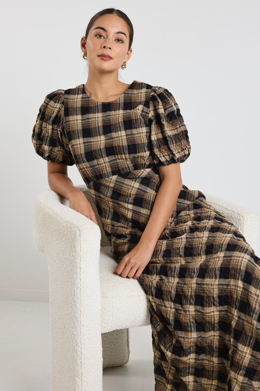 The encore caramel check dress brings easy charm and a little drama to your wardrobe.  Available from www.thecollectivenz.com