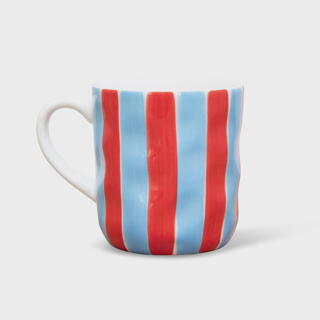 Striped mug with red and blue pattern on a white background