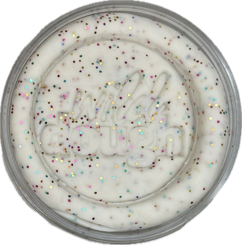 White cream with colorful sprinkles in a round container on a white background