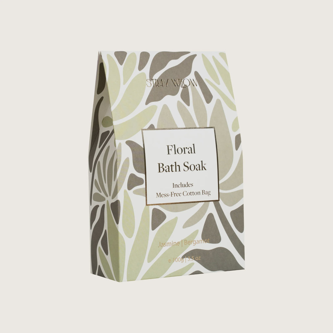 Floral bath soak packaging with leaf pattern on a light gray background