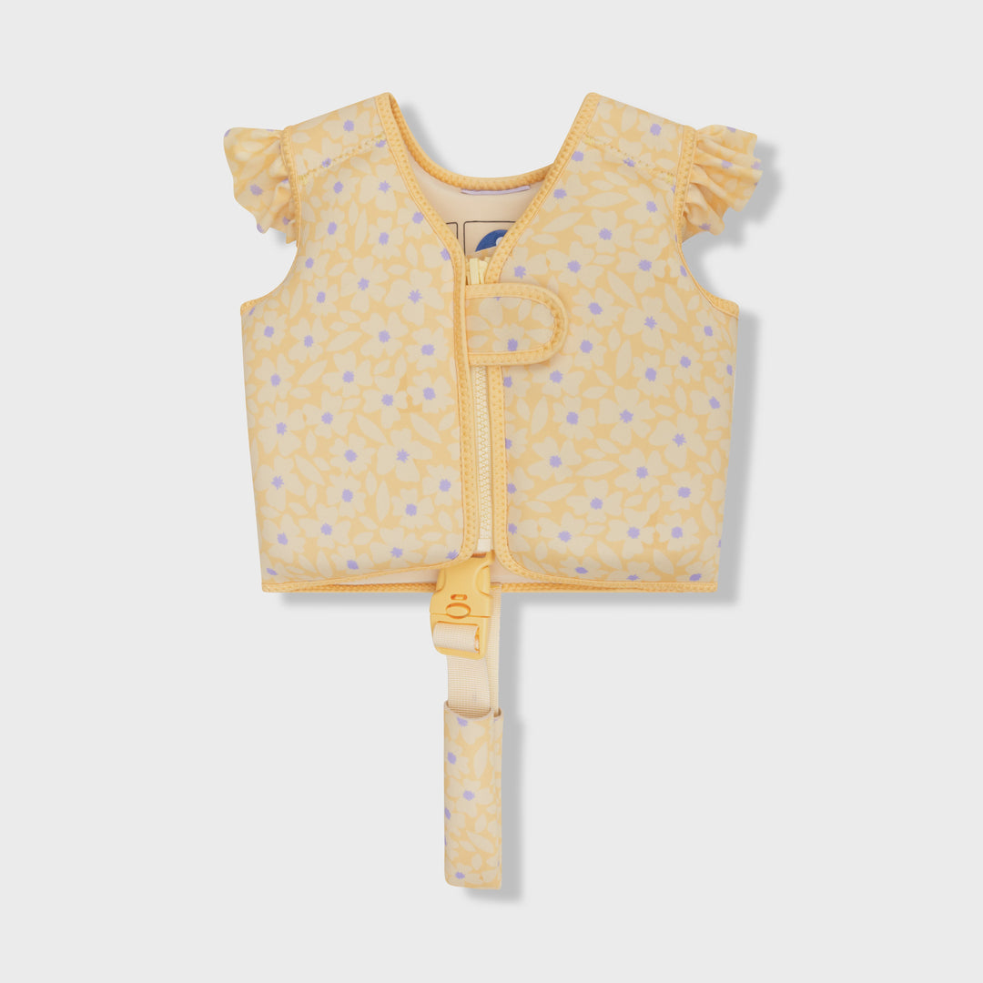 A yellow baby float vest with a light purple floral pattern, featuring ruffled sleeves, a front zipper, and a matching safety strap, shown on a light gray background.