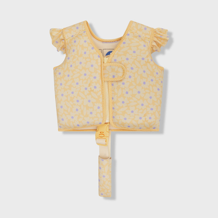 A yellow baby float vest with a light purple floral pattern, featuring ruffled sleeves, a front zipper, and a matching safety strap, shown on a light gray background.