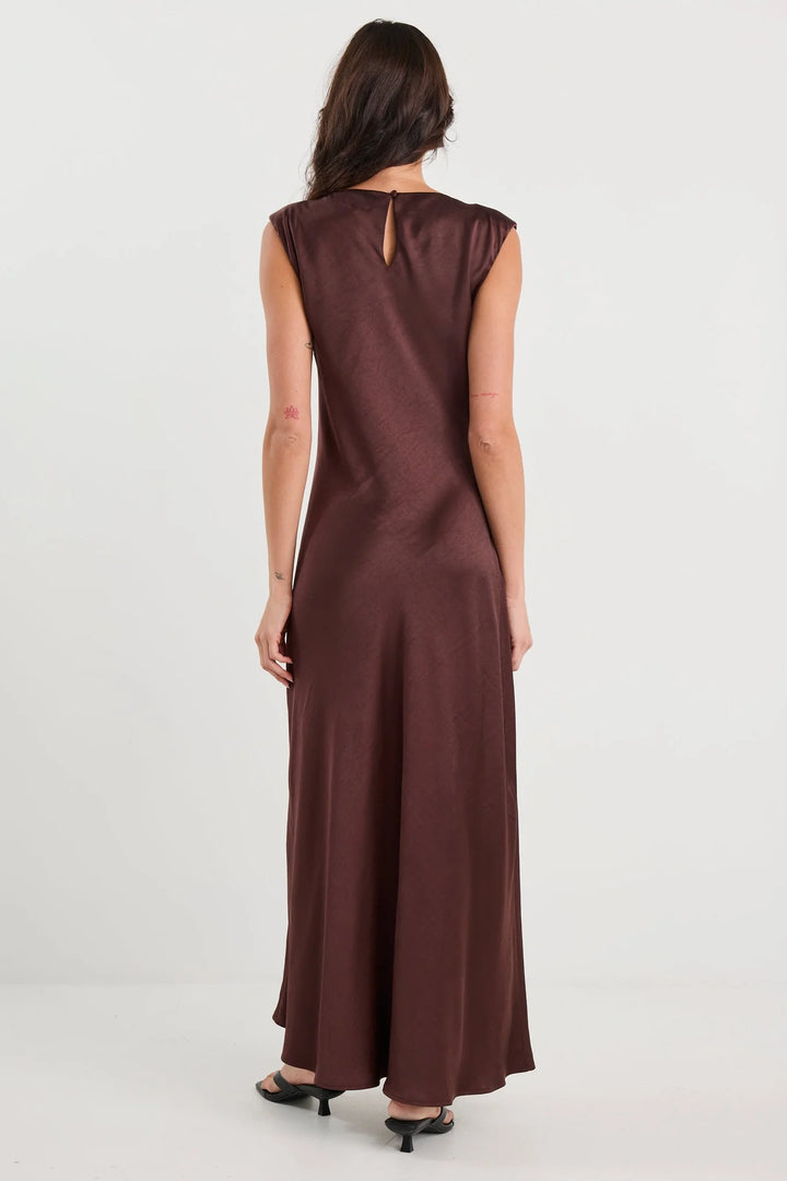 Brown dress worn by a person on a white background
