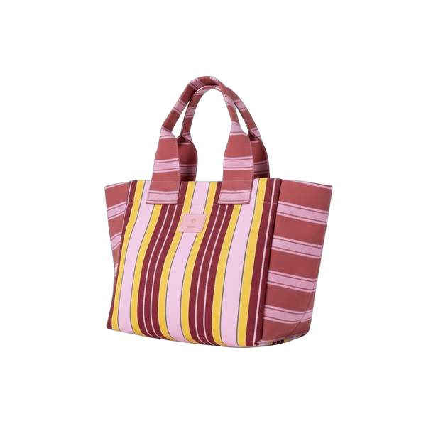Striped tote bag with red, pink, and yellow pattern on a white background