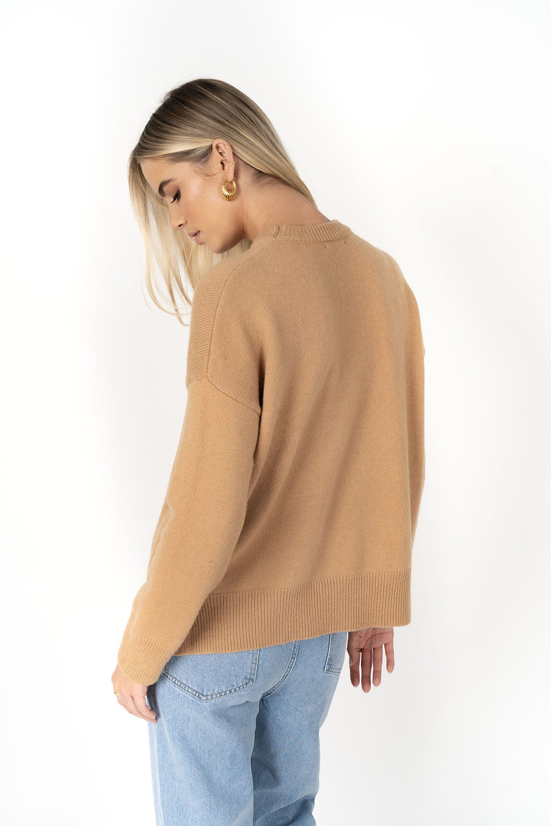 Cosy up in the beautiful Asha Jumper. This lightweight wool jumper will keep you warm and cozy in the cooler months with her non itchy wool blend. Available from www.thecollectivenz.com