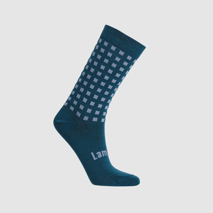 Blue sock with white checkered pattern on a white background