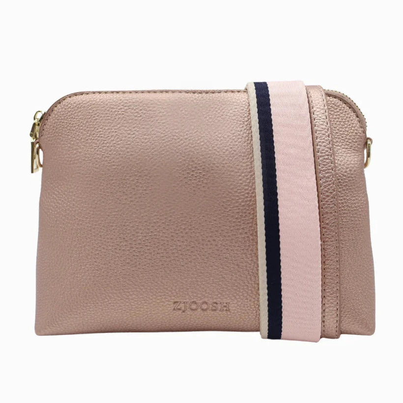 Our Hudson Cross Body Bag combines style and function with two removable straps: a classic PU strap with gold chain and a playful striped webbing strap. Available from www.thecollectivenz.com