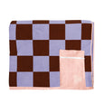 Checkered towel with a pink pouch on a white background