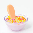 dolls Glass bowl with colorful cereal and a popsicle on a white background