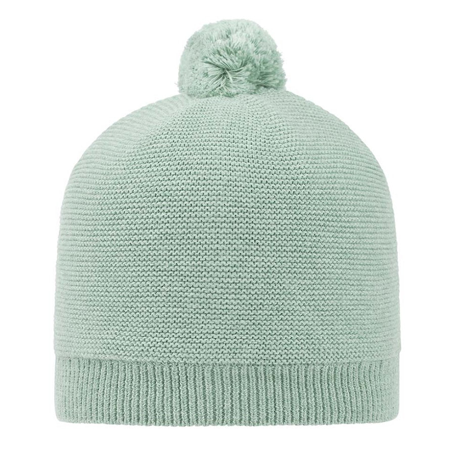 Light blue knit beanie with a pom-pom on a white background