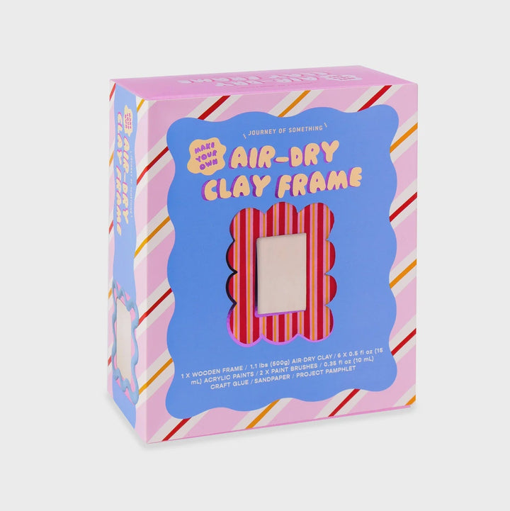 A boxed craft product labeled 'Air-Dry Clay Frame' by Handmade with Love, shown in a pink and blue retail box with a window revealing the striped frame inside, on a white background.