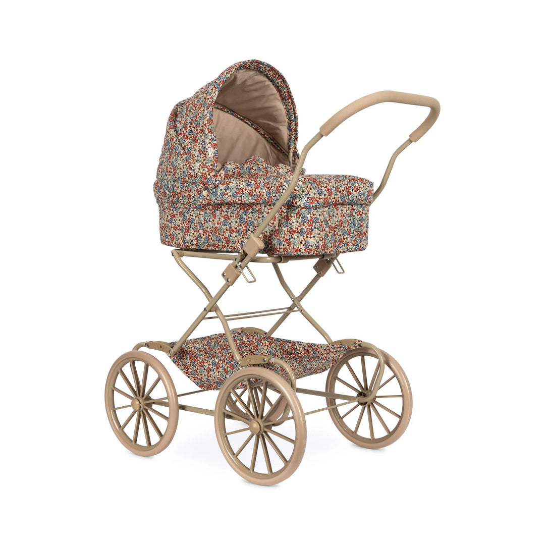 Vintage-style baby pram with floral pattern on a white background