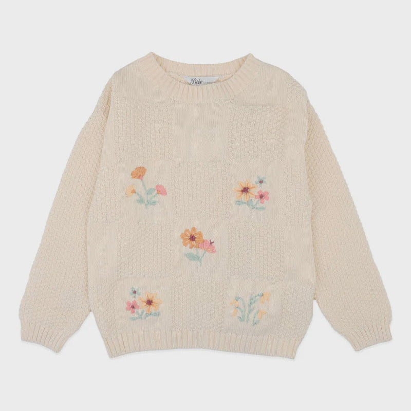 Beige sweater with floral embroidery on a white background