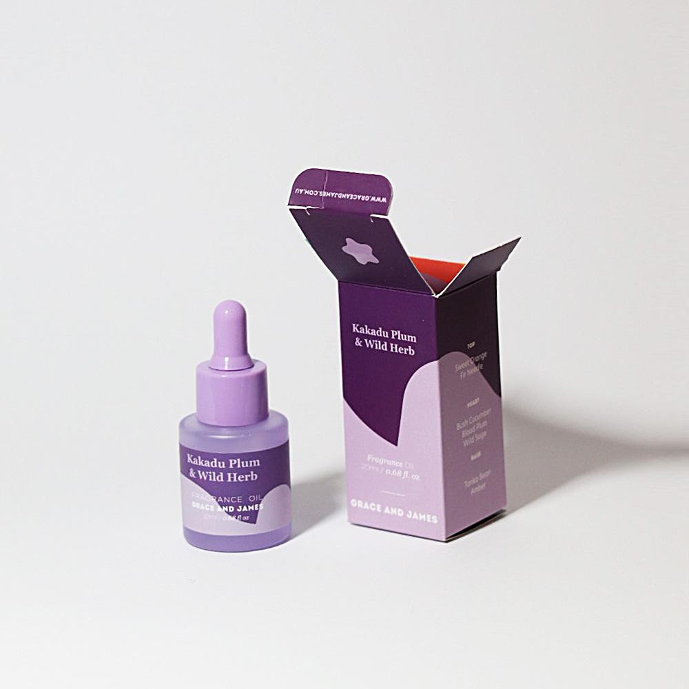 Purple skincare dropper bottle and packaging on a white background