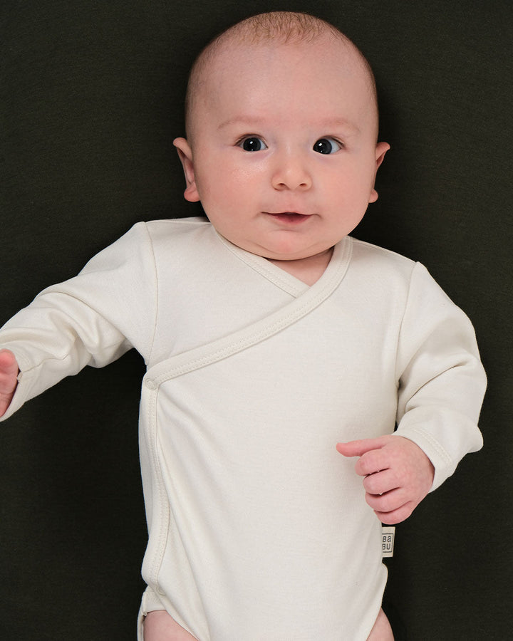 Babu kimono bodysuits are soft, breathable, and designed for easy dressing, a must-have for newborns. Made from premium organic cotton, it provides a gentle, cosy layer against delicate skin. Available from www.thecollectivenz.com