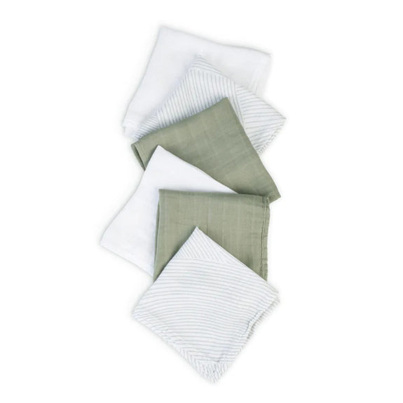 Set of four folded fabric swatches in white and green on a white background