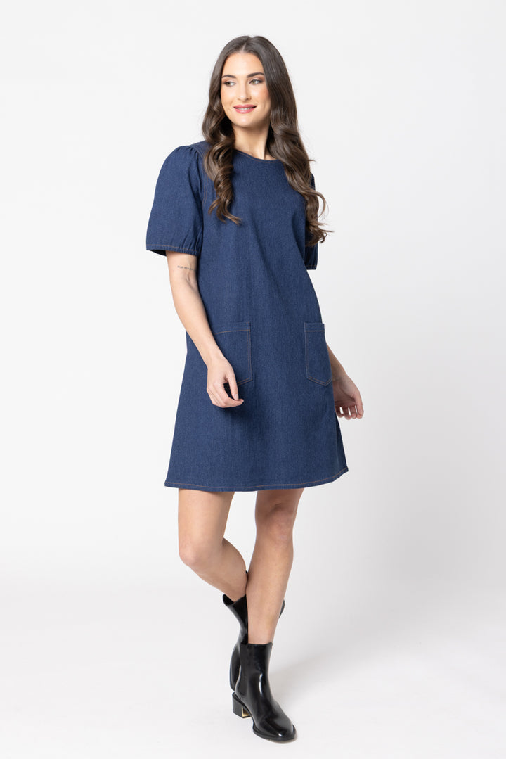 Woman wearing a blue dress on a white background