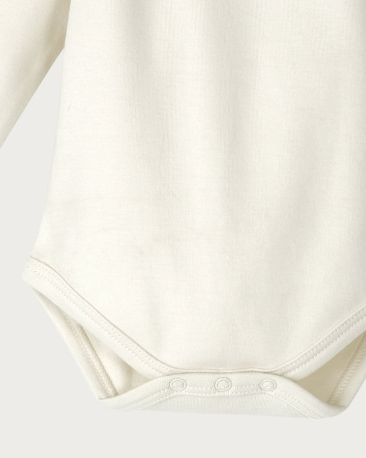 Organic Cotton Long Sleeve Bodysuit is a must-have for your baby's wardrobe. Made from super-soft organic cotton that's gentle on delicate skin, it’s perfect for sleeping and everyday wear, available from www.thecollectivenz.com