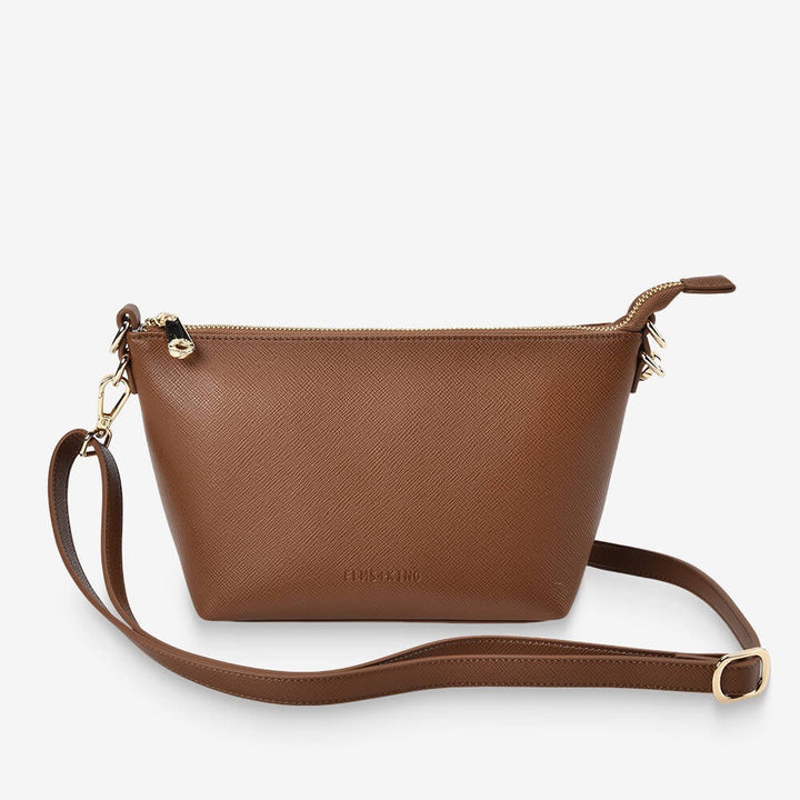 Brown leather crossbody bag on a white background