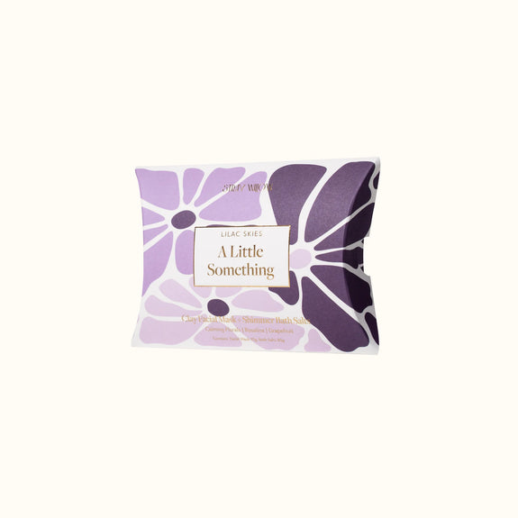 Purple floral soap packaging with 'A Little Something' text on a white background