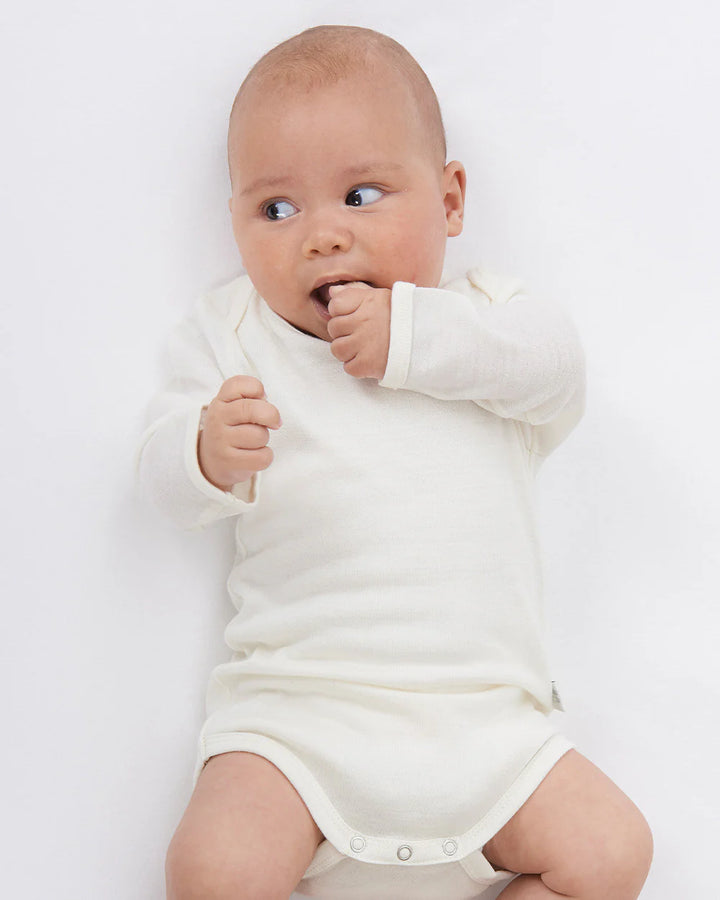 Babu Long-Sleeved Merino Bodysuit is an essential layette wardrobe staple available from www.thecollectivenz.com