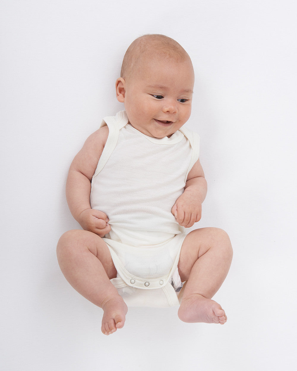 Merino Singlet Bodysuits are perfect for wearing on their own in the warmer months or for layering up in cooler seasons without restricting arm movement. Available from www.thecollectivenz.com