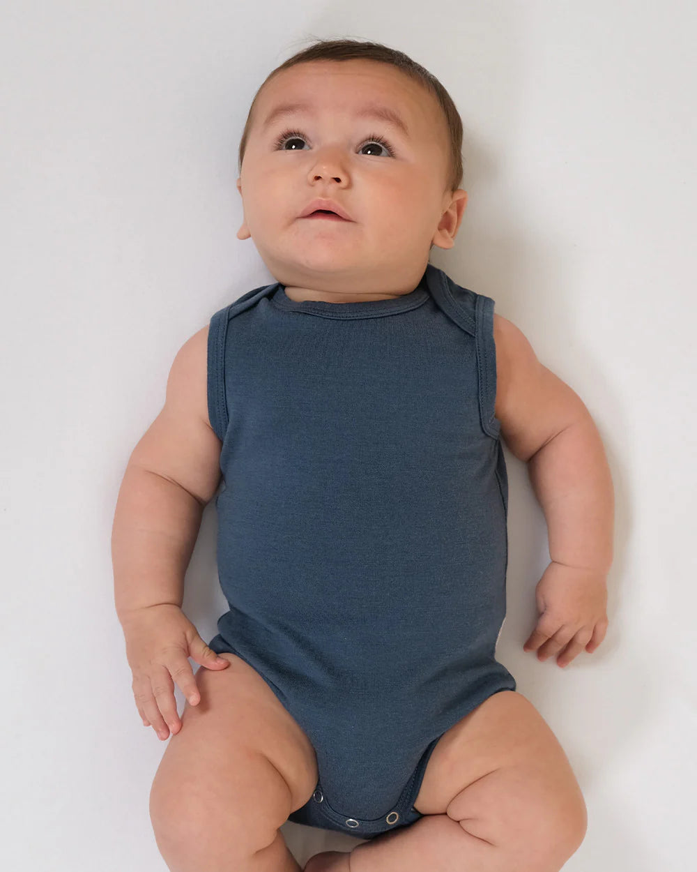 Merino Singlet Bodysuits are perfect for wearing on their own in the warmer months or for layering up in cooler seasons without restricting arm movement. Available from www.thecollectivenz.com