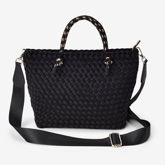 Black woven handbag with a strap on a white background