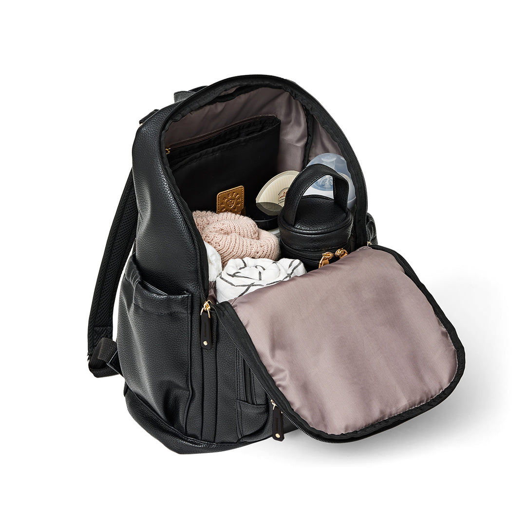 Pretty brave black nappy backpack with compartments filled with items on a white background