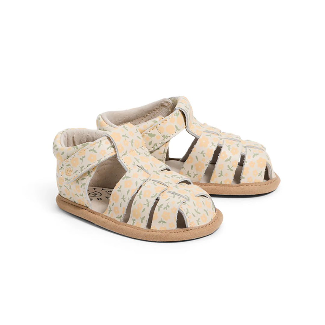 Pair of pretty brave baby sandals with floral pattern on a white background