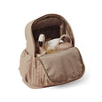 Pretty Brave beige diaper backpack with a swan toy inside on a white background