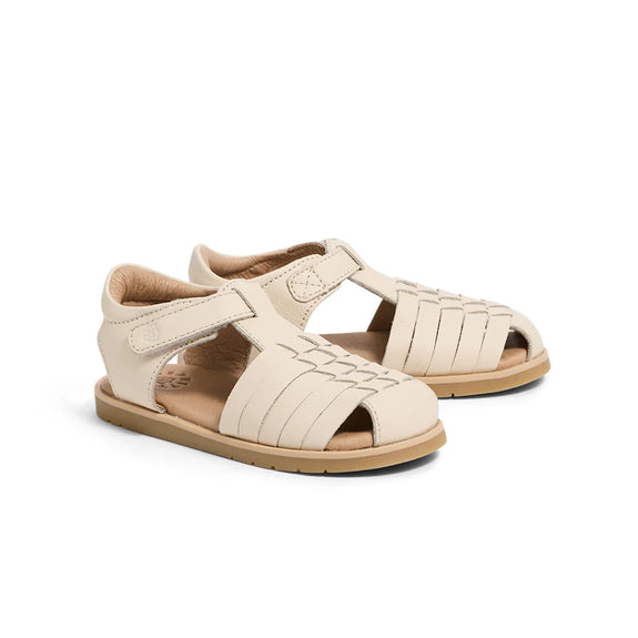 Pair of beige pretty brave sandals on a white background