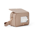 Pretty Brave beige diaper bag with a window showing tissues on a white background