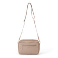 Pretty Brave beige crossbody nappy bag on a white background