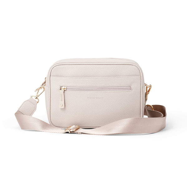 Pretty Brave stone crossbody diaper  bag with a strap on a white background