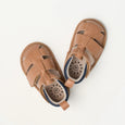Pair of pretty brave brown baby sandals on a white background