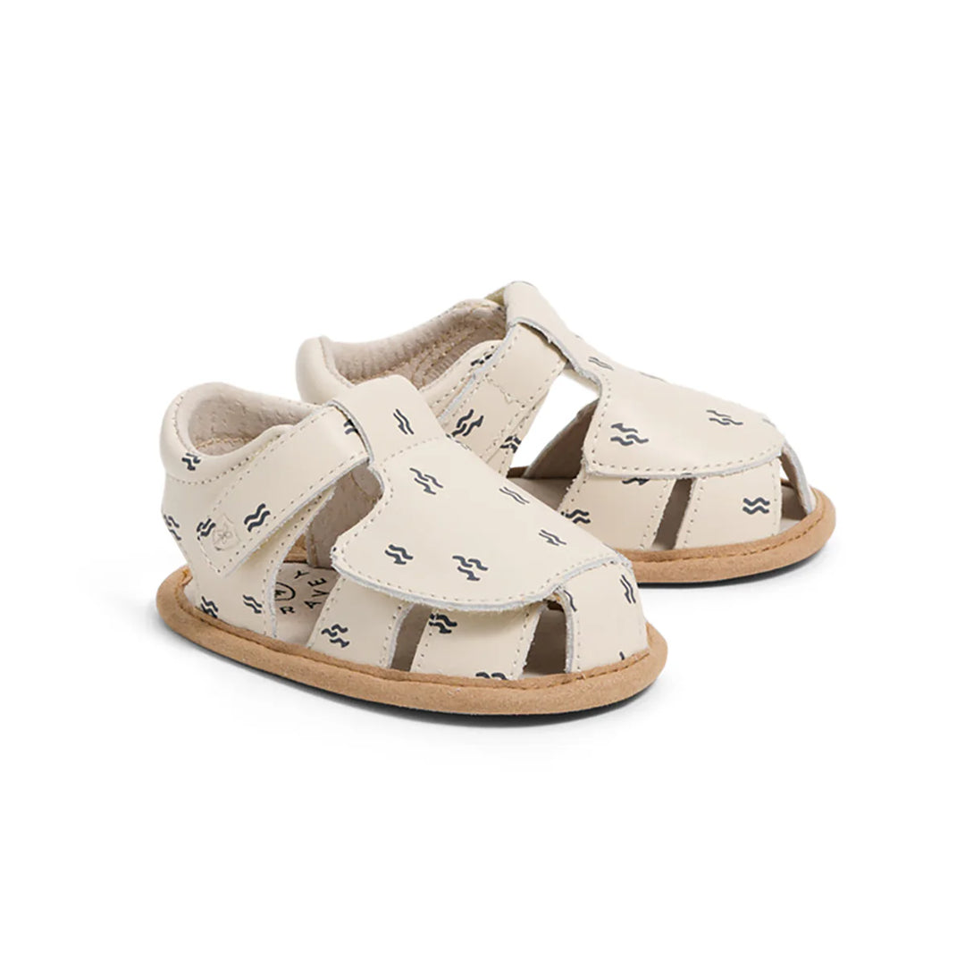Pair of pretty brave baby sandals with a pattern on a white background