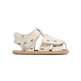 Beige pretty brave sandal with black patterns on a white background