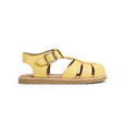Yellow pretty brave sandal with a brown sole on a white background