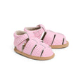 Pair of pink checkered pretty brave baby sandals on a white background