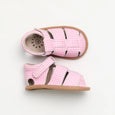 Pair of pink checkered pretty brave baby sandals on a white background