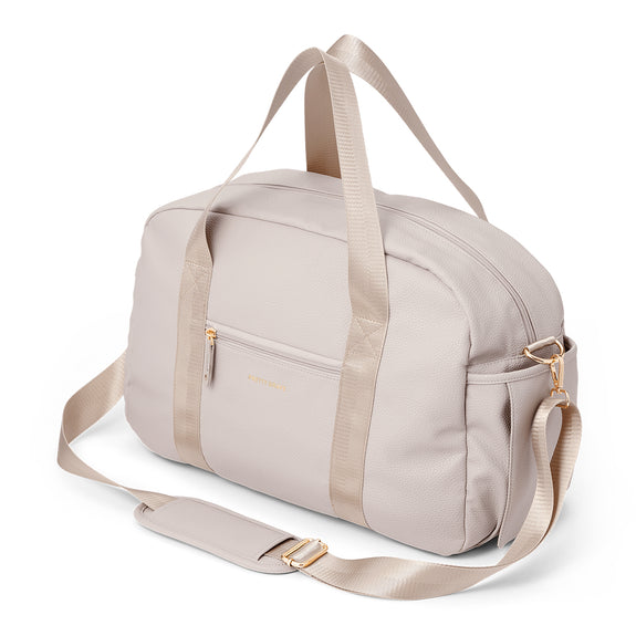pretty Brave stone nappy bag with gold zippers on a white background