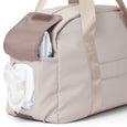 Pretty Brave stone diaper bag with a clear pocket showing a diaper and bottle.