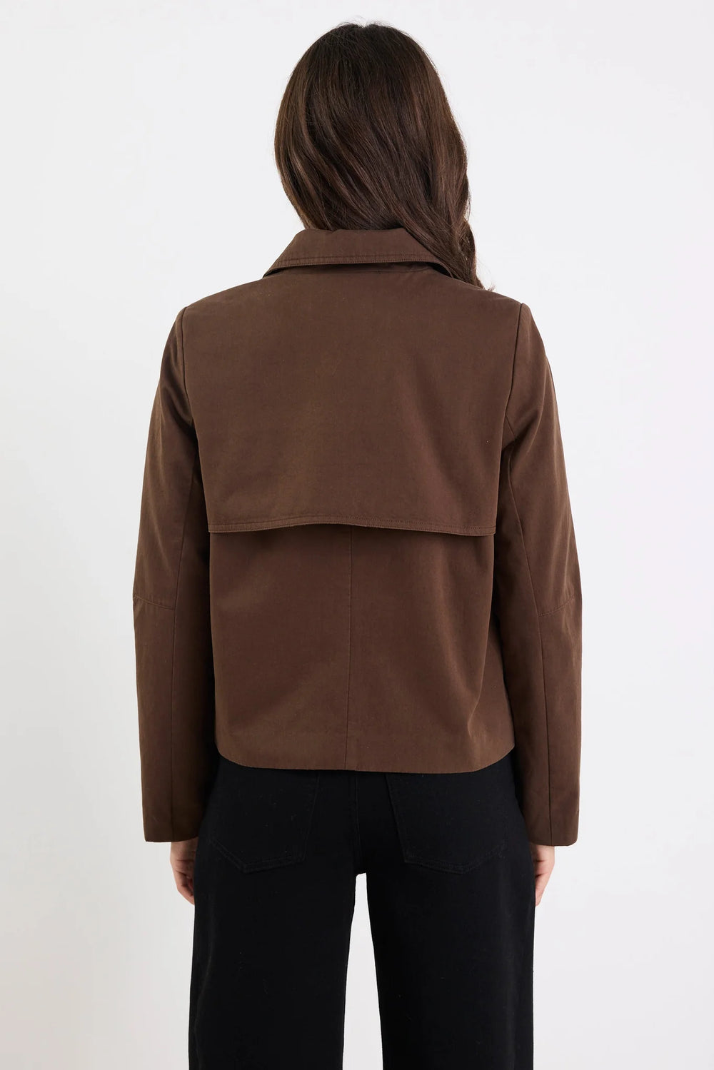 Brown jacket worn by a person on a white background