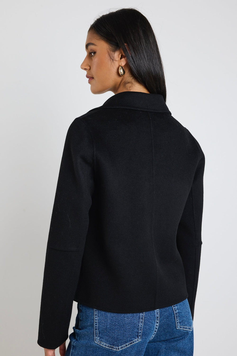 Add a touch of sophistication to your wardrobe with the Prestige Short Black Marle Coat. Crafted from a premium wool blend, this coat features a tailored silhouette with a double-breasted button front, making it a timeless piece for layering. Available from www.thecollectivenz.com